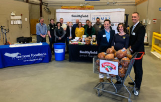 Group photo of Vermont Foodbank staff and representatives from Smithfield Foods and Hannaford Supermarkets.