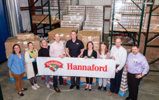 Photo of Hannaford associates and Vermont Foodbank staff with donated food.