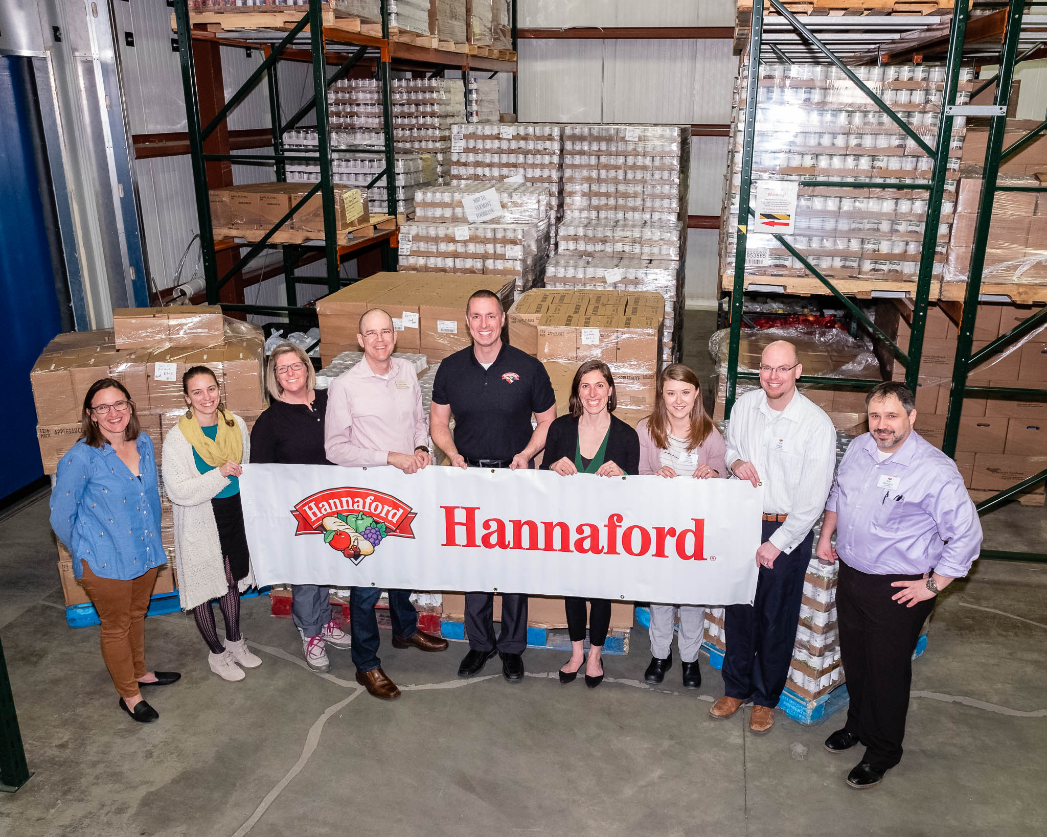 Photo of Hannaford associates and Vermont Foodbank staff with donated food.