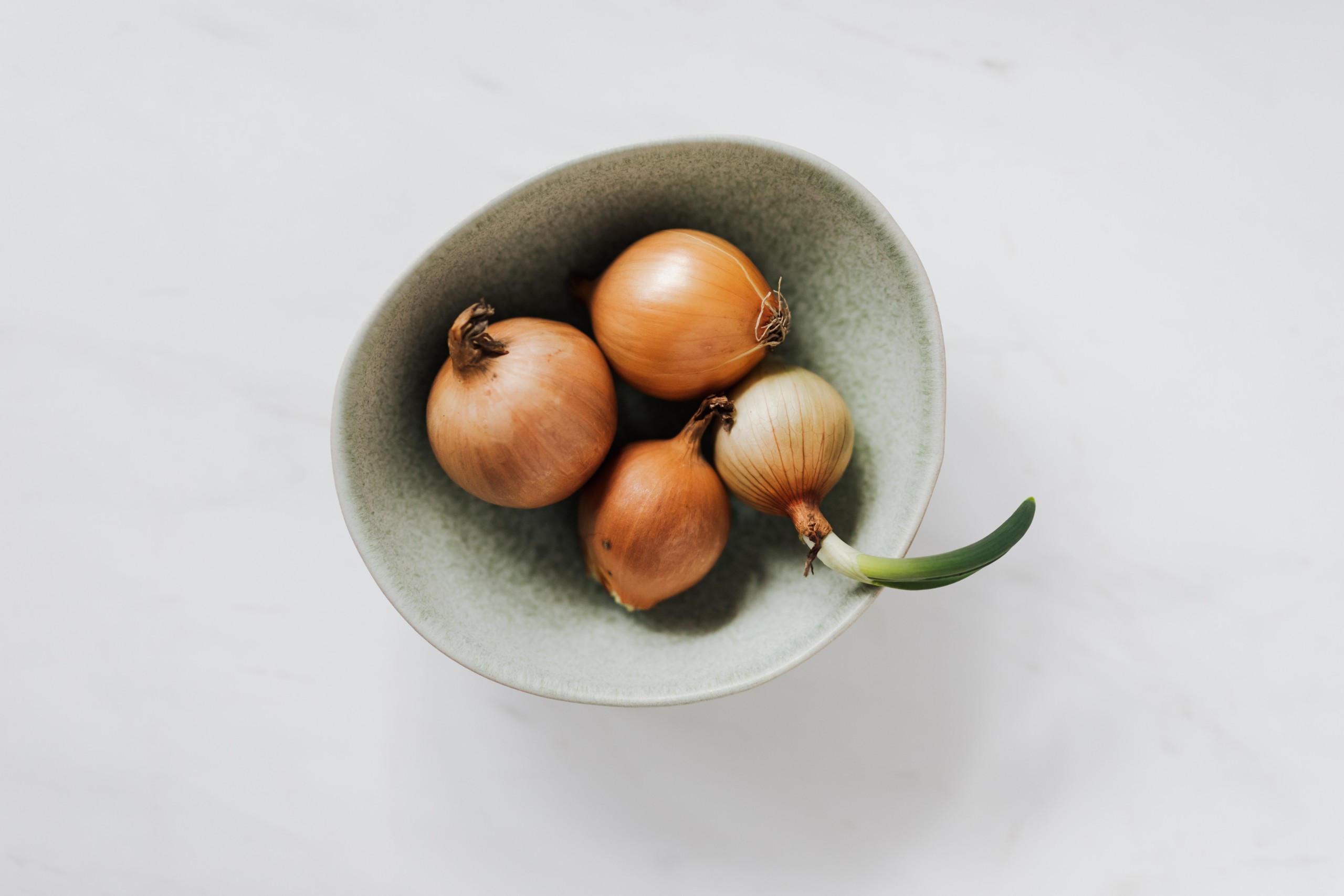 Photo of onions in a bowl