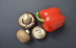 Photo of mushrooms and a red bell pepper