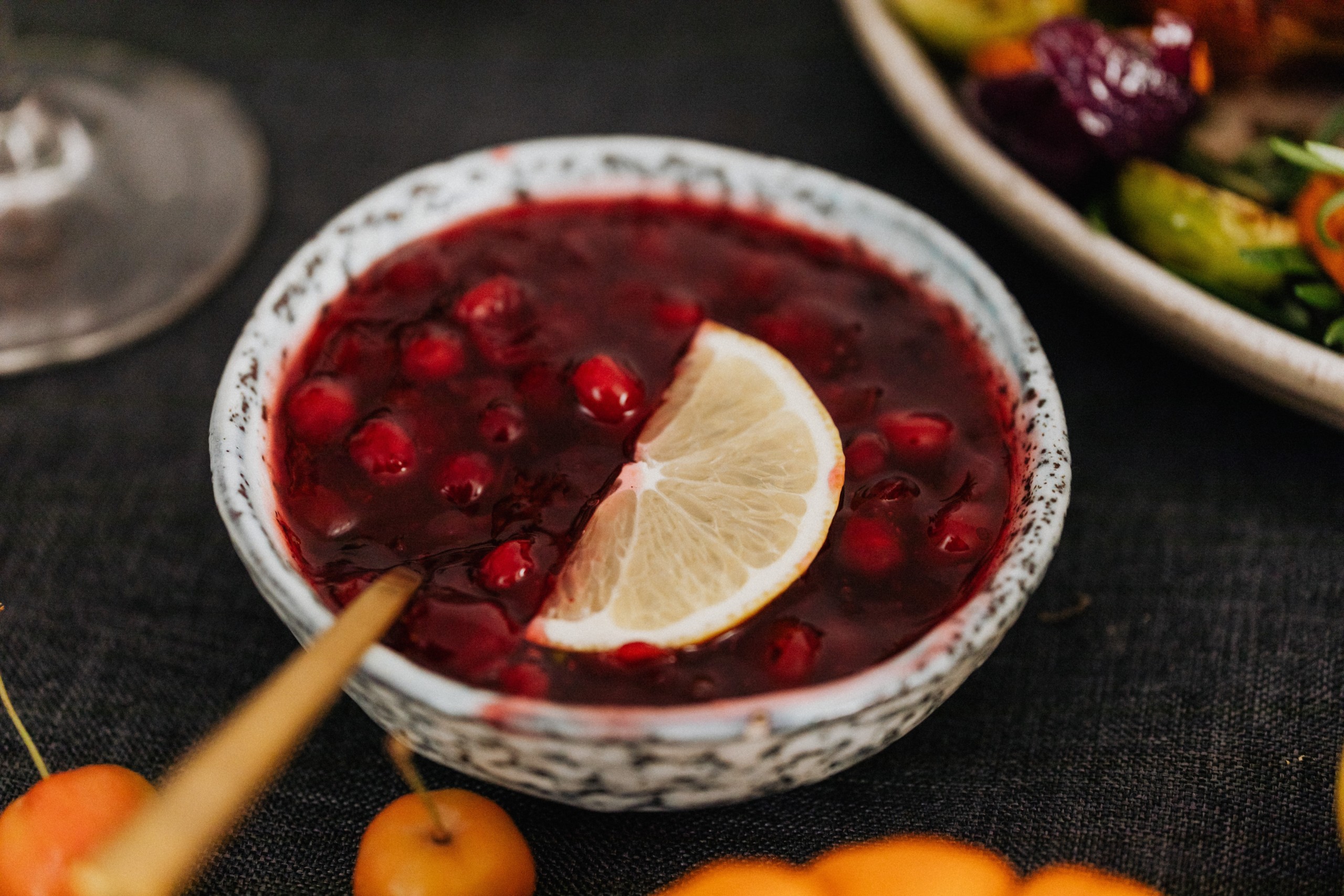 Photo of cranberry Sauce in a bowl with lemon