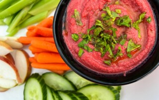 Picture of Photo of Beet Hummus with vegetable slices for dipping