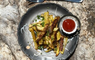 Photo of Rutabaga Fries on plate with side of ketchup
