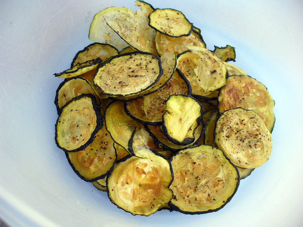 Photo of white bowl filled with Baked Zucchini Chips
