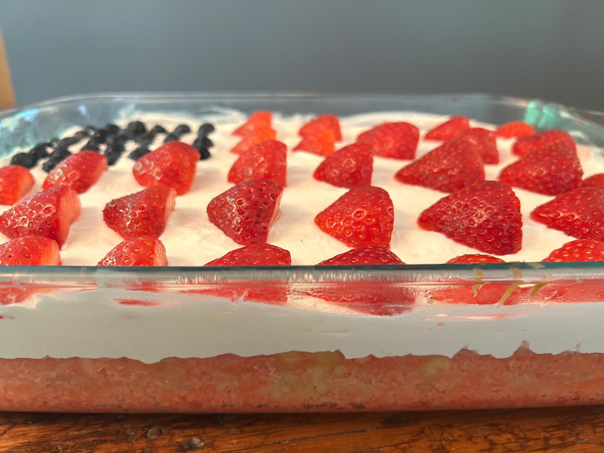 IMG_0965 Soft, jello infused cake topped with whipped cream and berries.